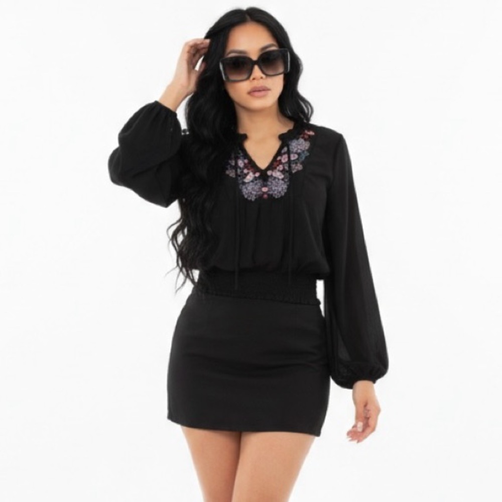 Chic Black Top with Floral Detail